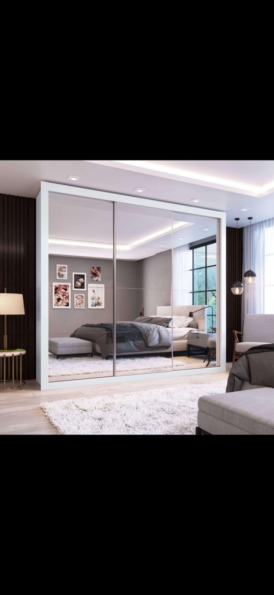 Full-height mirrored sliding-door fitted wardrobe in a modern bedroom